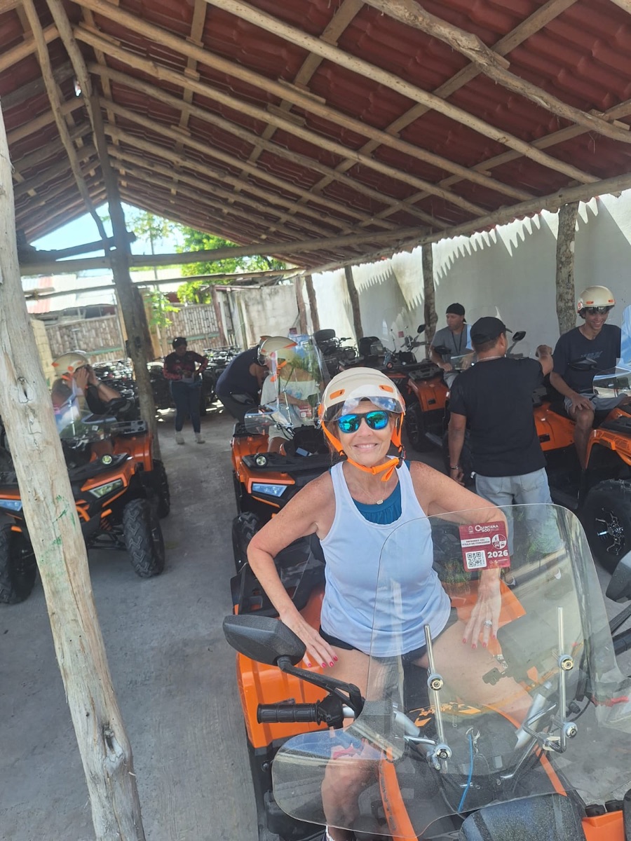 Happy rider on orange ATV Mahahual