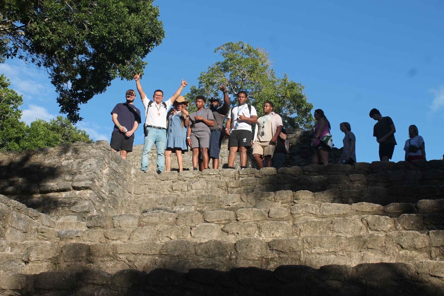 Group on Chacchoben pyramid steps
